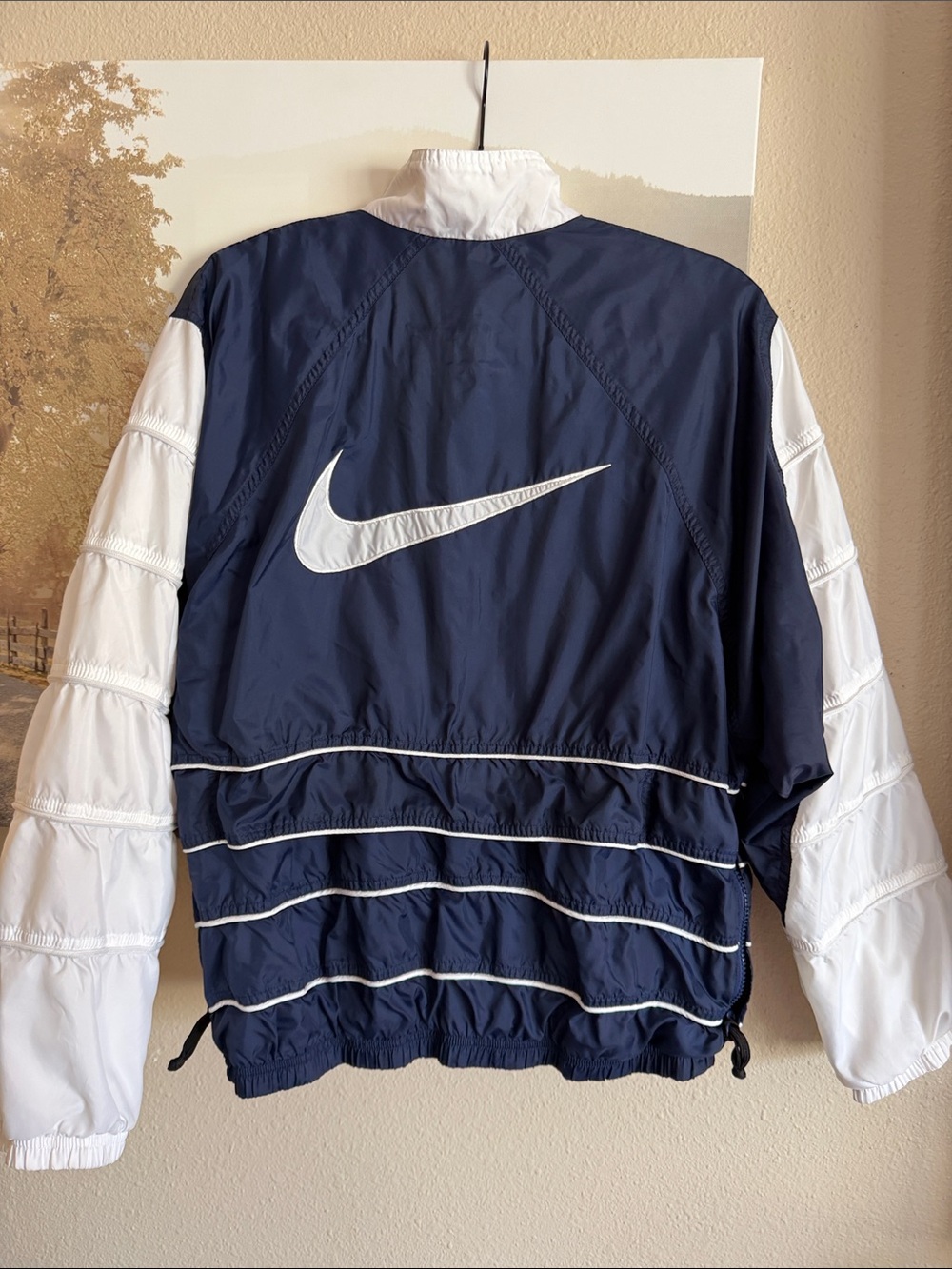 Vintage 1990s Nike navy blue and white windbreaker jacket